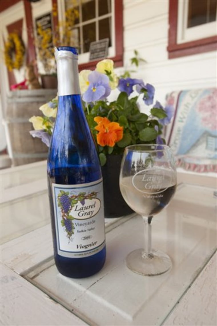 This undated photo released by NC Tourism/Bill Russ shows a bottle of Laurel Gray Viognier in Hamptonville, N.C. The number of wineries in North Carolina has more than quadrupled since 2001. Currently, the state ranks seventh in wine production in the United States.     (AP Photo/NC Tourism, Bill Russ) FOR EDITORIAL USE ONLY; ONE-TIME USE ONLY; NO SALES; MANDATORY CREDIT: NC TOURISM/BILL RUSS.